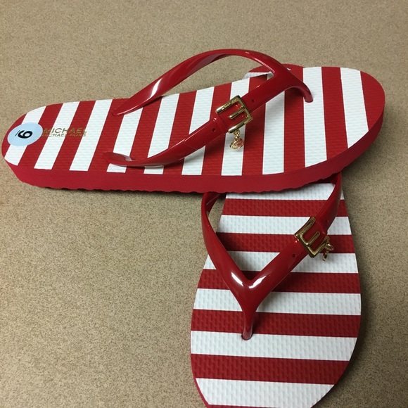 Michael Kors Shoes - New! Michael Kors stripped letter E flip flops
